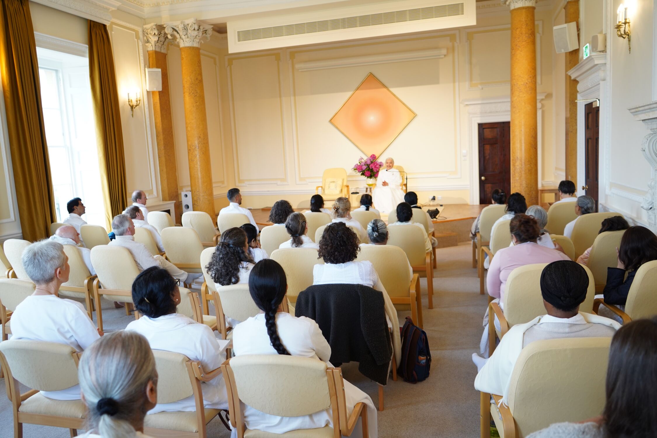 Morning class and meditation with regular students at the Global Retreat Centre, Oxfordshire.